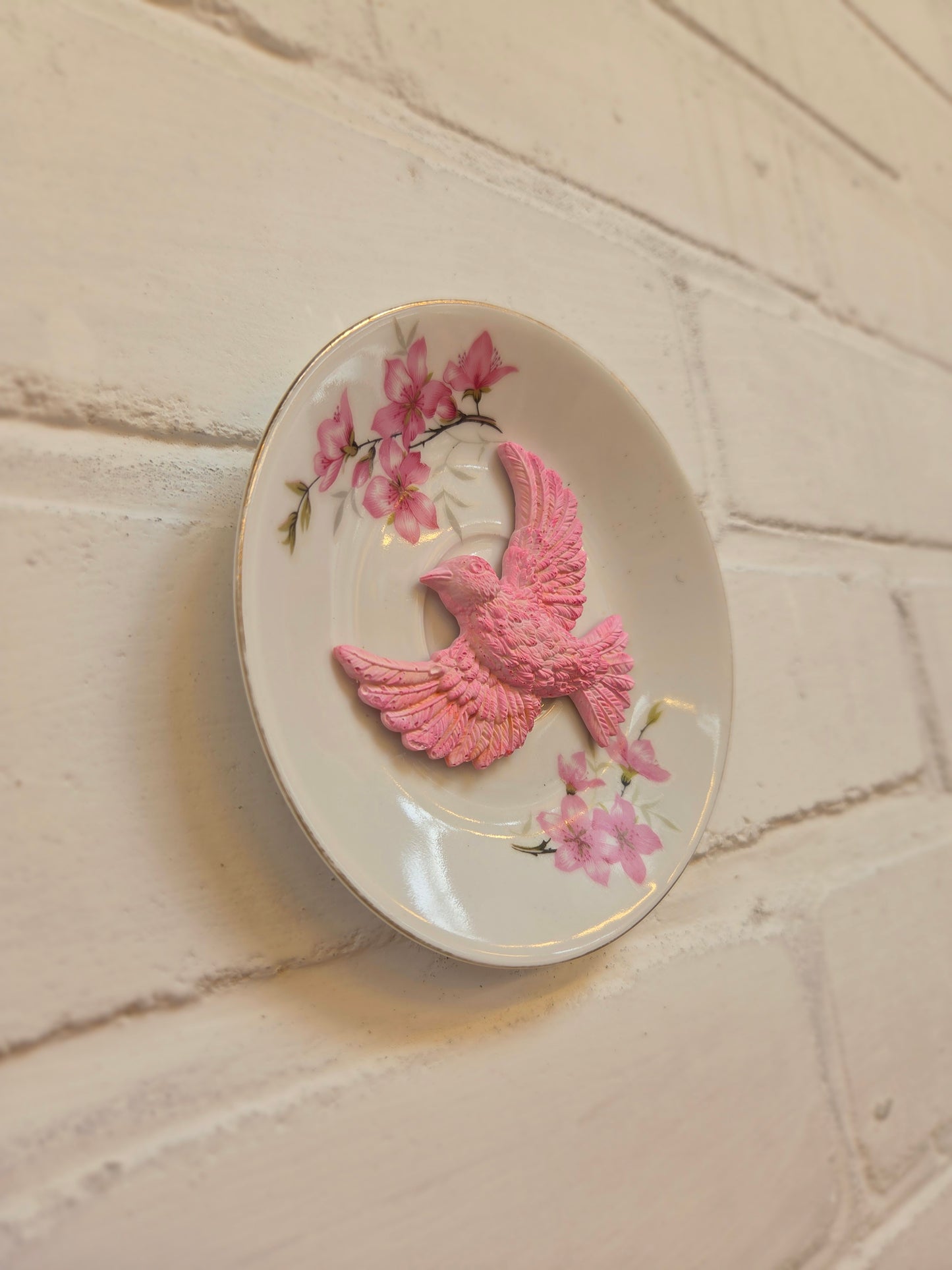 Wandbordje met roze vogel